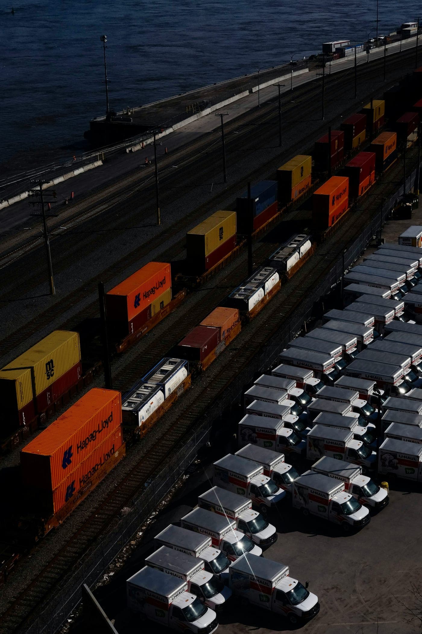 Cargo containers on trains and trucks at a port